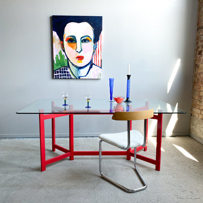 Matbord med glasskiva och röd benställning