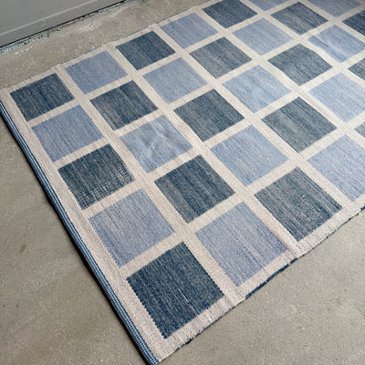 Rutig dubbelvävd ullmatta