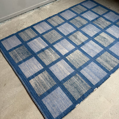 Rutig dubbelvävd ullmatta